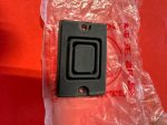 Black recessed cabinet pull handle with nested square frames on a red surface; has screw holes at top and bottom.