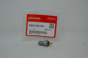 Honda Genuine Parts label with part number 35600-KE8-003 and a metal threaded sensor in front.