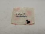 White plastic bag packaging with a barcode label reading 90103-HC4-770 and a small black Phillips-head screw resting on the bottom right.