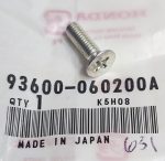 Close-up of a silver Phillips screw on a plastic bag with a barcode and 'MADE IN JAPAN' text beside it.