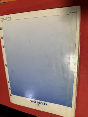 IMG_2156 Binder with a blue punched-sheet inside; holes along the left edge and a white outer border showing the brand name 'HONDER' at the bottom.