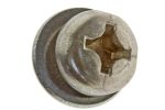 Close-up of a rusty metal bolt head with a cracked, square-shaped recess surrounded by a circular flange (damaged fastener).