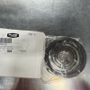 White box labeled Pure, showing a spiral spring bearing in clear plastic wrap on a stainless steel work surface.