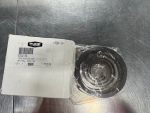 White box labeled Pure, showing a spiral spring bearing in clear plastic wrap on a stainless steel work surface.