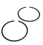 Two black metal split rings with small gaps on a white background.