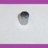Gray cylindrical pipe stub protruding from a white wall.