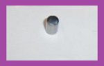 Gray cylindrical pipe stub protruding from a white wall.