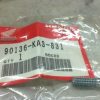 Small Honda genuine-part bag labeled 90136-KA3-831 with a metal bolt beside it on a light surface.