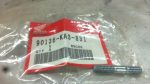 Small Honda genuine-part bag labeled 90136-KA3-831 with a metal bolt beside it on a light surface.