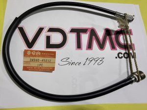 Coiled black automotive cable with a metal end fitting on a white surface, attached to a beige rope and Suzuki part tag showing 34940-45212 (1 pc).