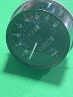Close-up of a car analog speedometer showing 0–130 mph with a rectangular odometer display against a green background.