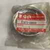 Suzuki genuine part label on a metal circular component in a plastic bag; part no. 51572-38B00, quantity 1, made in Japan.