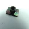 Small metal threaded insert on a square rainbow-colored base plate against a white background.
