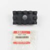 Black plastic rectangular component with raised edge tabs and a central circular hole, placed above a Suzuki genuine parts bag labeled 44541-34500.