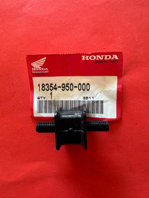 s-l1600 Honda genuine parts label with part number 18354-950-000 and a black threaded bolt/component in front of the tag.”,