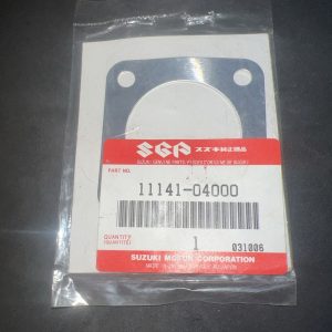 Suzuki genuine parts package showing a circular metal gasket with two mounting holes, part no. 11141-04000.