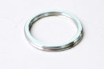 Small silver metal ring (washer) on a white surface.