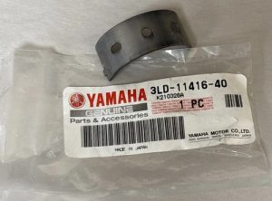 Small curved metal strap with two holes in Yamaha Genuine Parts bag