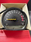 s-l140 Car instrument gauge with a yellow needle pointing near zero, in a cardboard box.