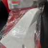 White motorcycle part inside a clear plastic bag with Yamaha Genuine Parts packaging visible