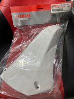White motorcycle part inside a clear plastic bag with Yamaha Genuine Parts packaging visible
