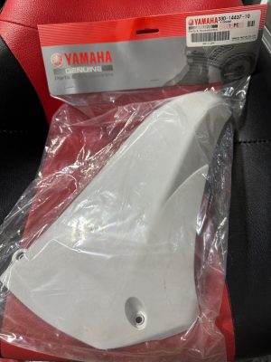 White motorcycle part inside a clear plastic bag with Yamaha Genuine Parts packaging visible