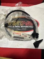 s-l400 Black curved motorcycle hose with a cone nozzle resting on Yamaha Vintage Dirt & Trail Motorcycle packaging.